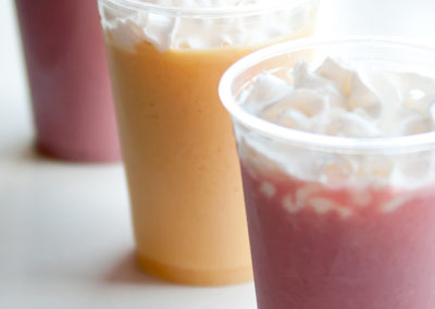 three smoothies in clear cups from a Pacific Perks event