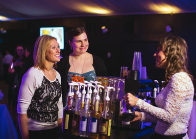 a Perkologist pours a drink while hosting a Pacific Perks espresso mobile café at a bar mitzvah