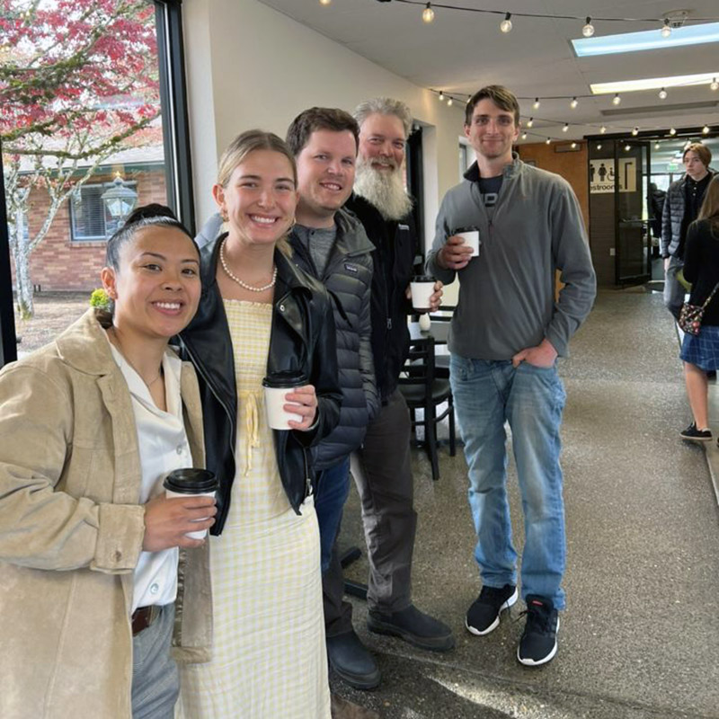 a group posing with their Pacific Perks espresso drinks at an Evergreen Christian Center