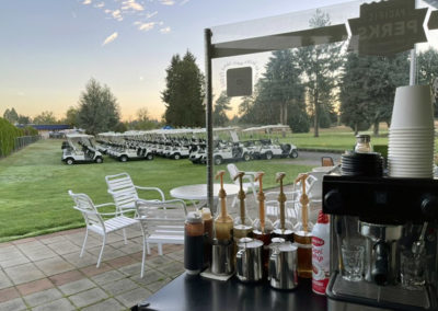 an outdoor Pacific Perks espresso mobile café at a golf event