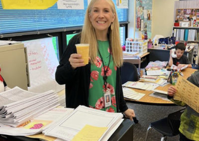 a Happy Valley teacher smiling with their Pacific Perks smoothie during an appreciation event