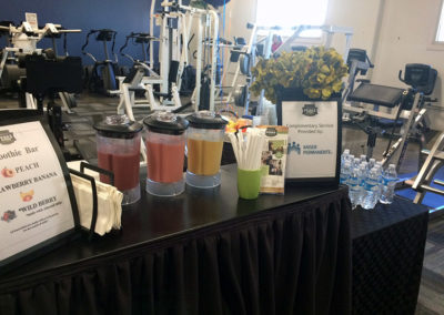 a Pacific Perks smoothie mobile café in a weights gym at a Kaiser event