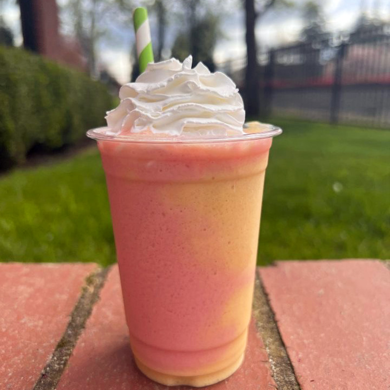 a pink and yellow rainbow smoothie from Pacific Perks