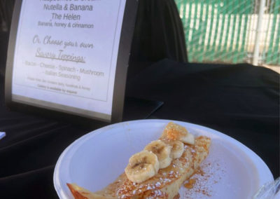 a plated crepe with the menu for an event with a Pacific Perks mobile café