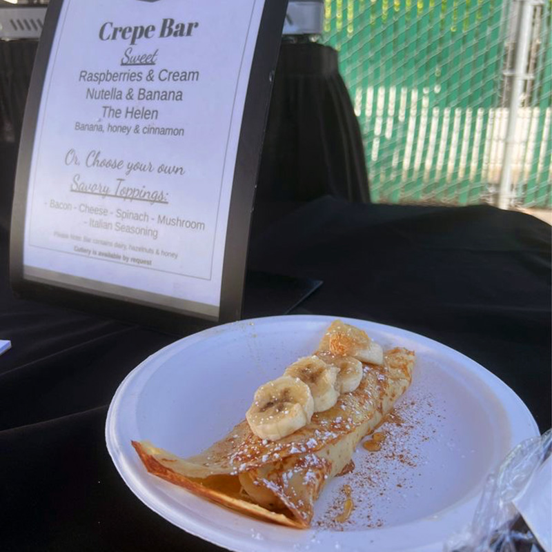 a plated crepe with the menu for an event with a Pacific Perks mobile café