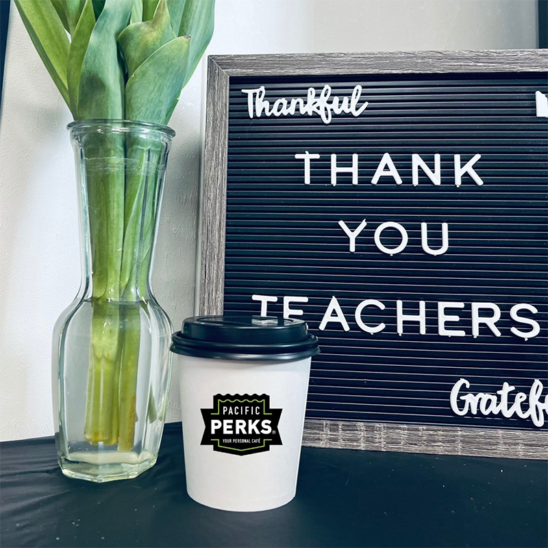 a coffee drink from a Pacific Perks mobile café sitting in front of a sign that reads "Thank you teachers"