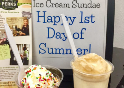 a Pacific Perks ice cream sundae and root beer float in front of a sign celebrating the last day of summer
