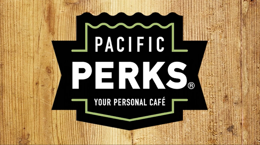 the Pacific Perks logo over a wood texture background