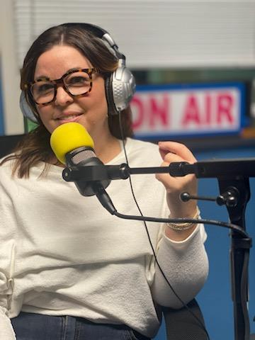 Natalie Fairchild recording a radio podcast episode