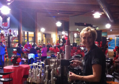 a Perkologist smiling while hosting a coffee bar at a graduation party