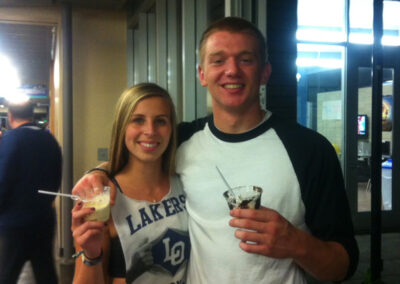 two high school graduates enjoy ice cream sundaes from Pacific Perks during a grad party