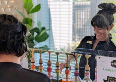 Kylie, a Pacific Perks Coffee Perkologist, serves a dirty soda from the mobile café