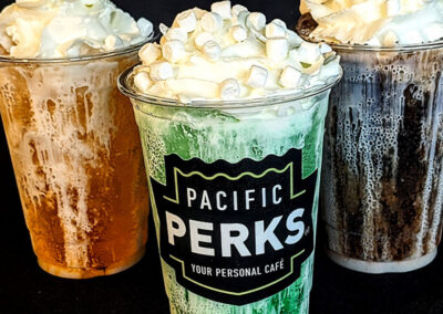 Three dirty sodas from a Pacific Perks Coffee mobile café with marshmallows and whipped cream