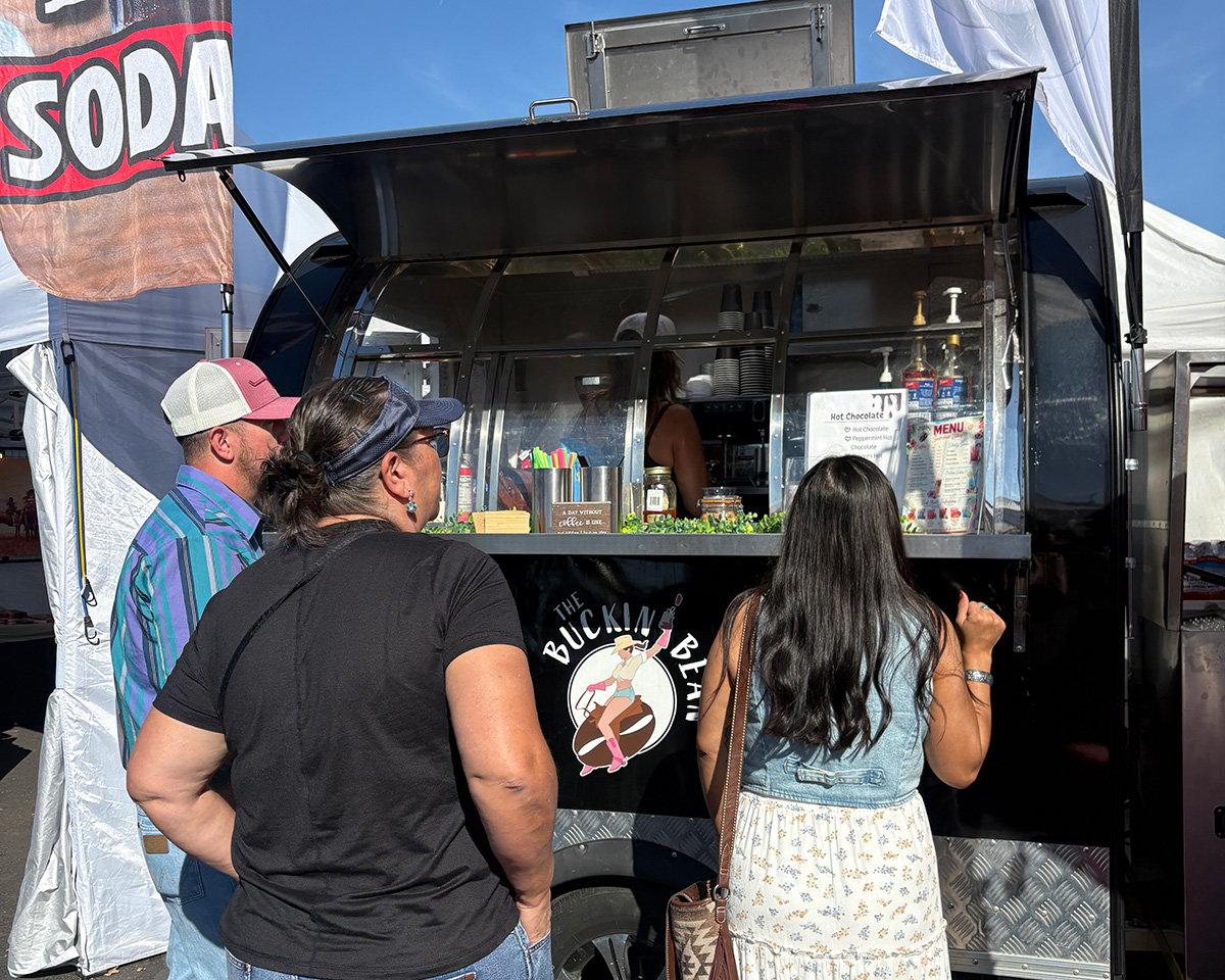 people standing at the Buckin Bean coffee trailer in Pendleton, OR people standing at the Buckin Bean coffee trailer in Pendleton, OR