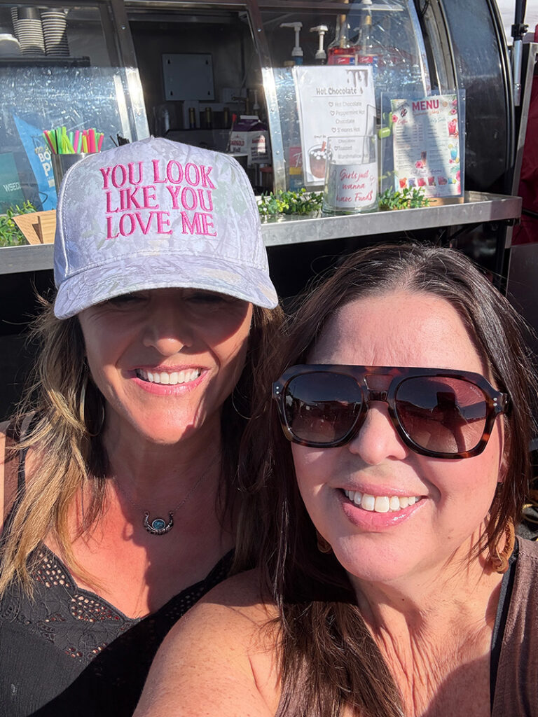 Joannie of the Buckin' Bean and Natalie of Pacific Perks Coffee smiling together in a selfie