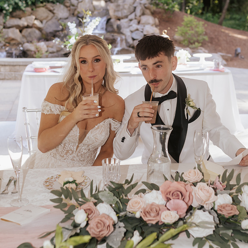 bride and groom sipping dirty sodas from Pacific Perks at their wedding